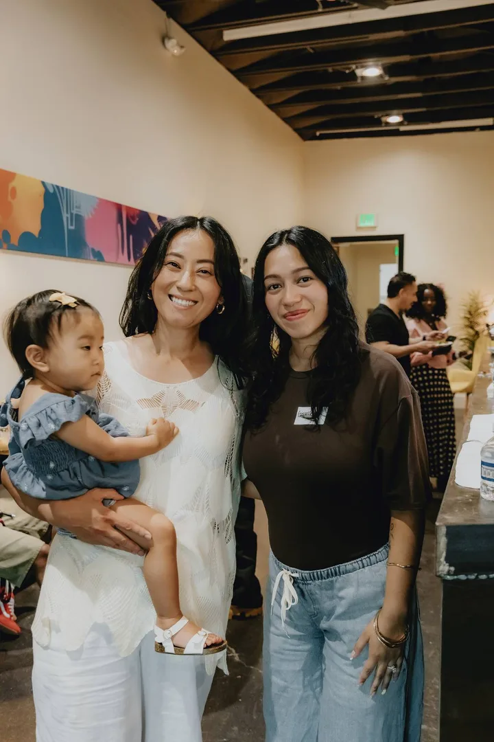 Two women and a young child together at a Sacramento Tabernacle gathering